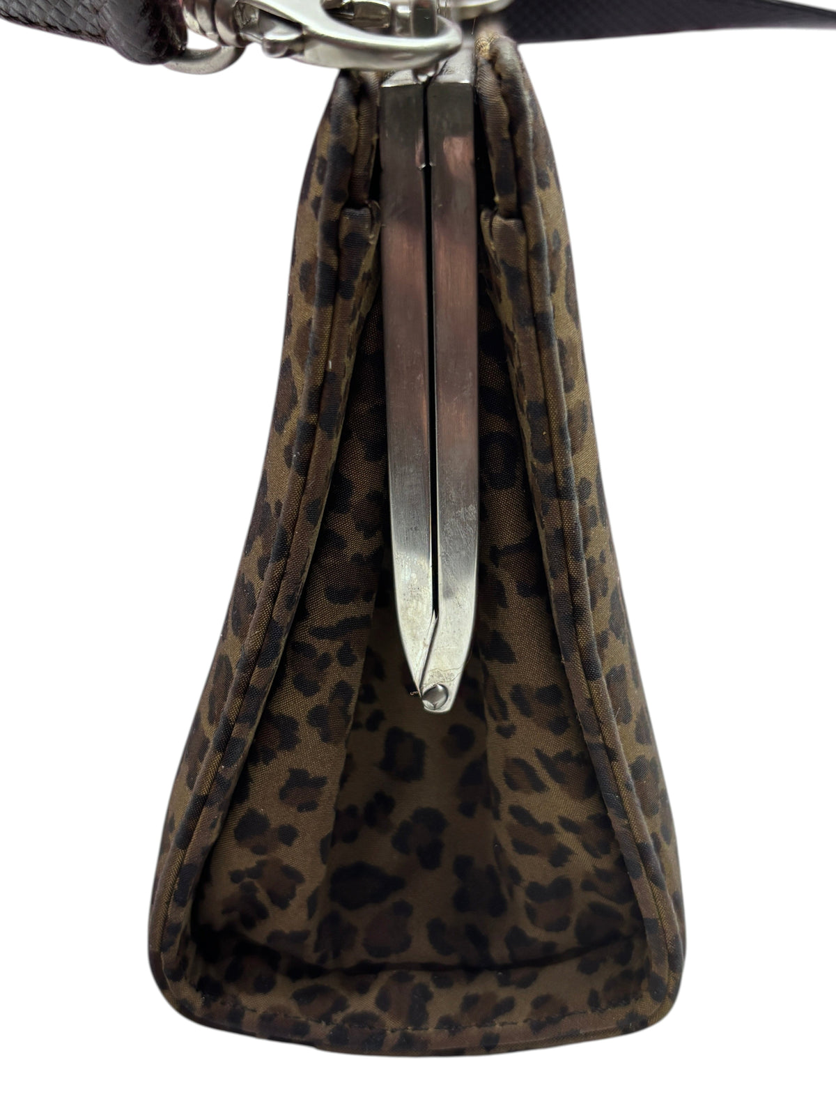 Side profile of a Posh Purse Co vintage Bottega leopard print box-frame crossbody bag with silver hardware