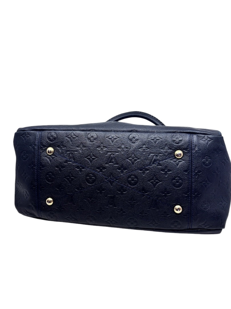 Base of a Posh Purse Co Louis Vuitton Artsy MM handbag in marine navy blue embossed Monogram Empreinte leather.