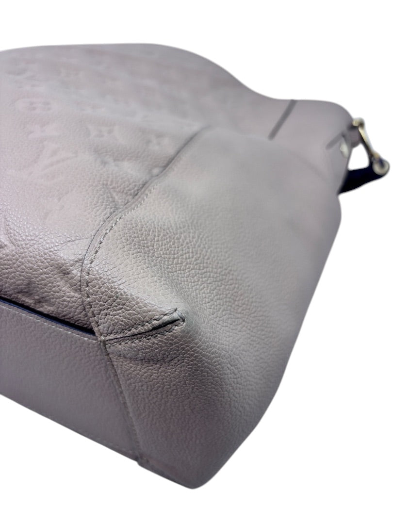 Close-up of the tan embossed leather corner on a Posh Purse Co Louis Vuitton Bagatelle hobo bag
