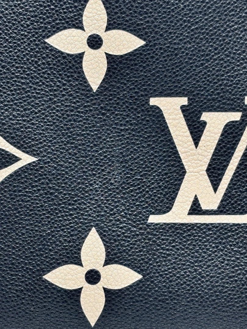Posh Purse Co Louis Vuitton Petit Palais handbag featuring a navy and cream bicolor giant monogram leather pattern