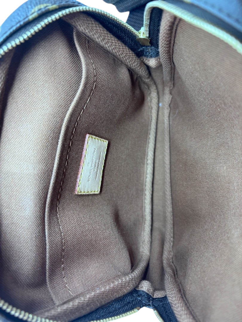 Interior of Posh Purse Co Louis Vuitton Bosphore belt bag showing brown fabric lining and leather logo patch