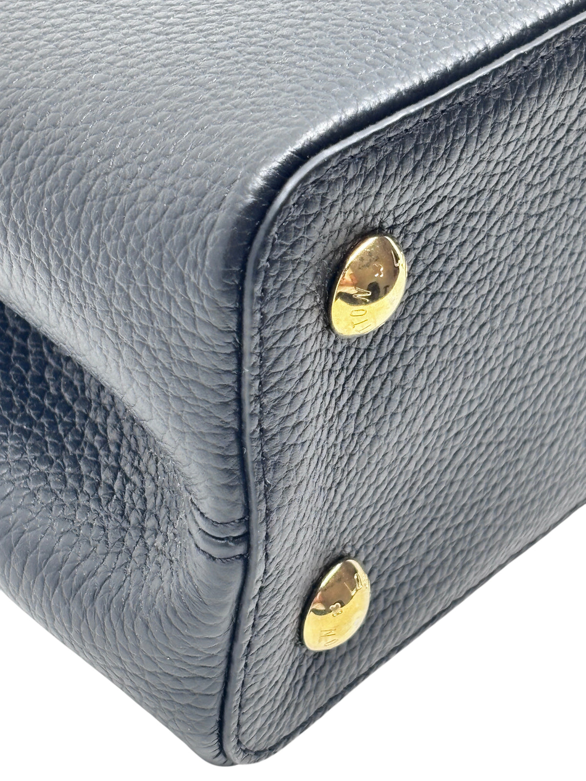 Posh Purse Co black pebbled leather Louis Vuitton Capucines MM handbag base with polished gold-tone hardware studs
