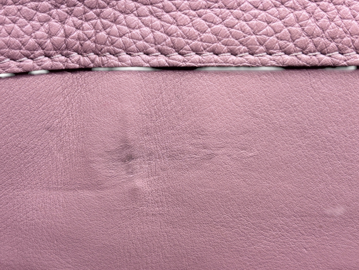 Close-up of beige leather texture on a Posh Purse Co preloved Louis Vuitton Capucines MM handbag showing minor wear