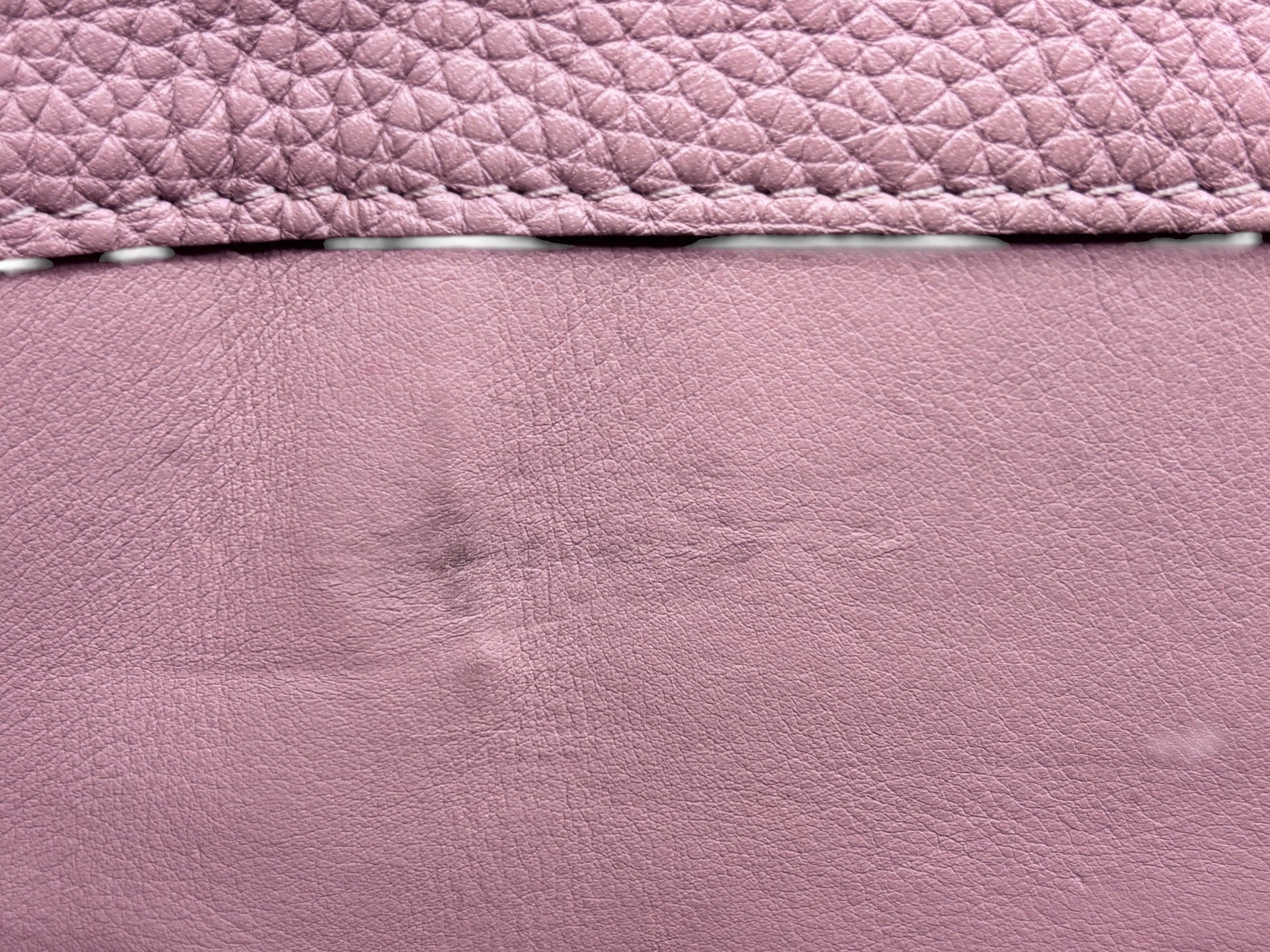 Close-up of beige leather texture on a Posh Purse Co preloved Louis Vuitton Capucines MM handbag showing minor wear