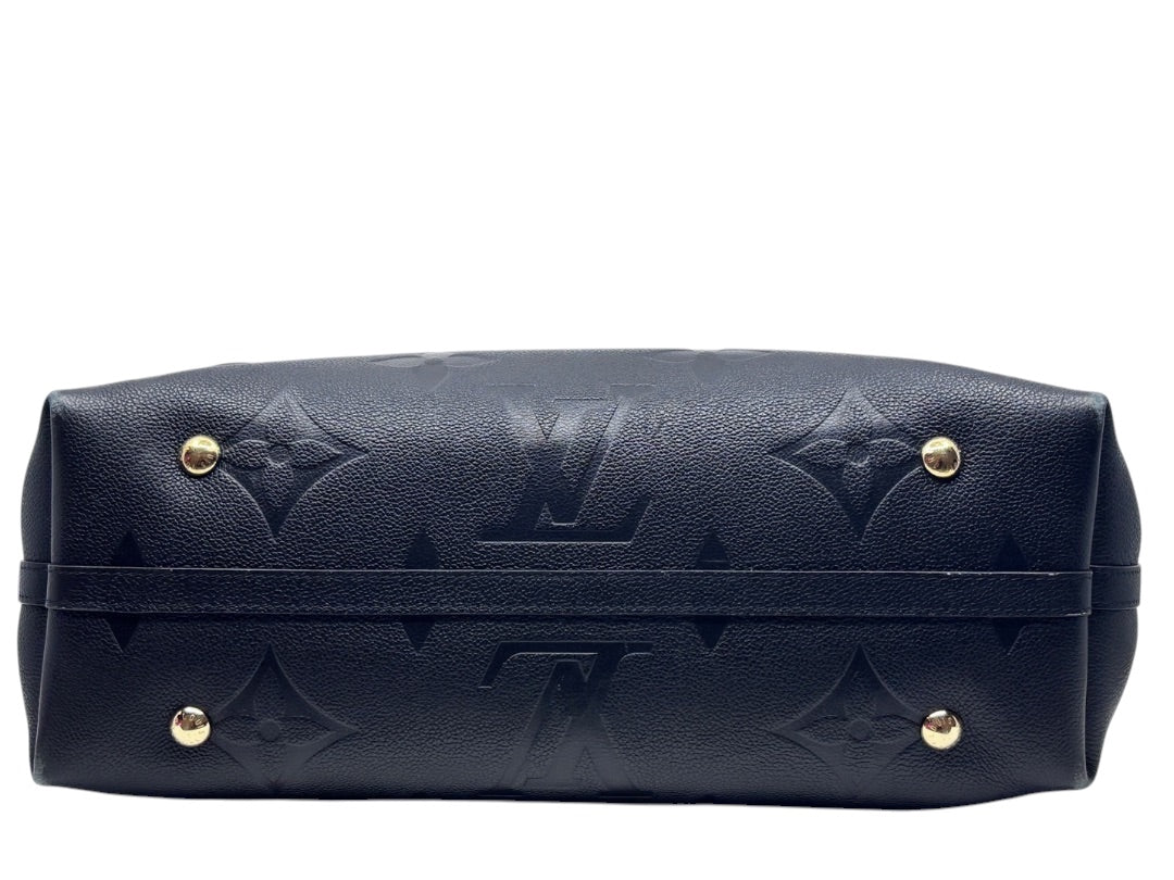 Posh Purse Co black Louis Vuitton CarryAll handbag base with gold protective feet and embossed monogram pattern