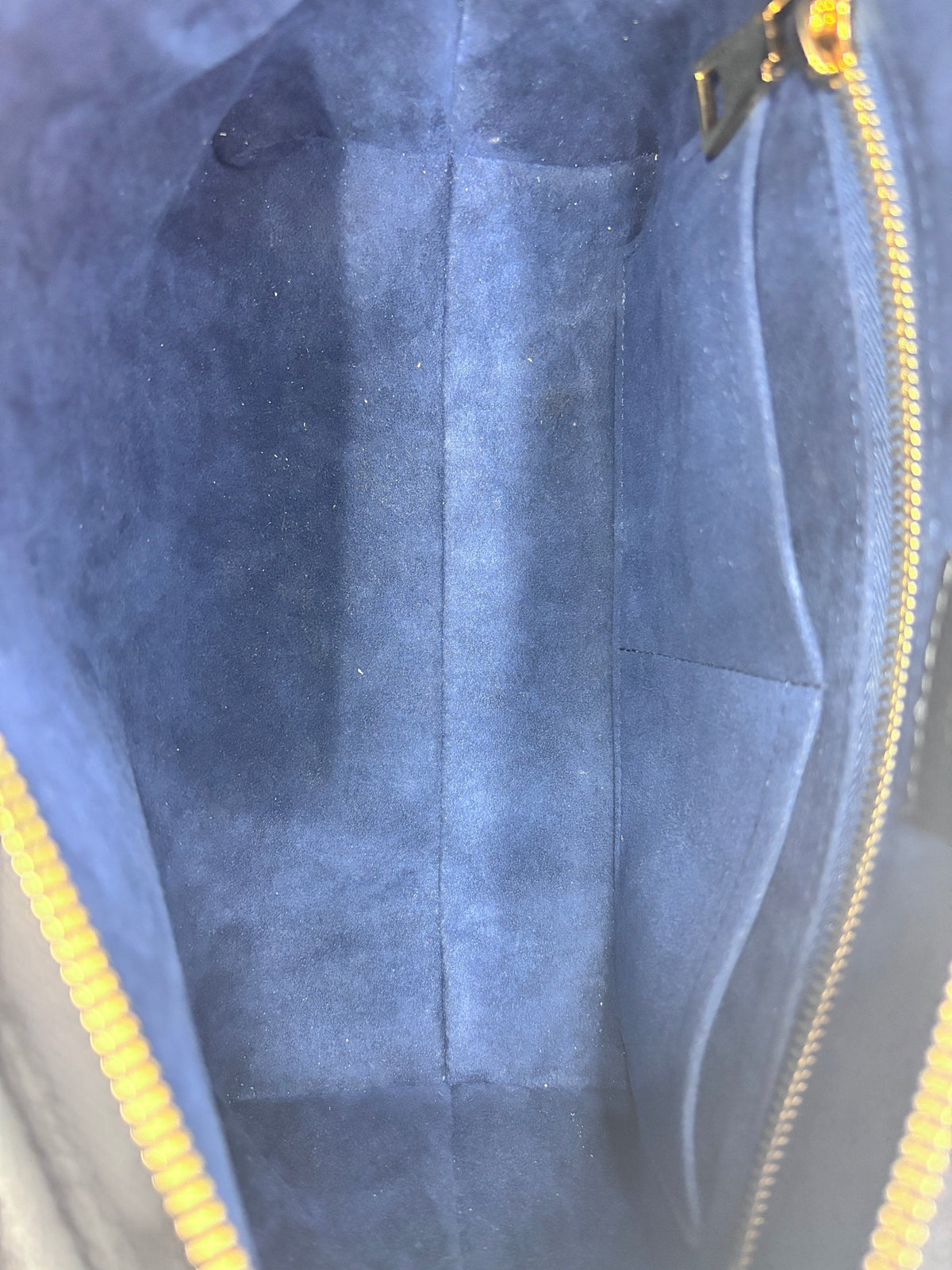 Posh Purse Co Louis Vuitton CarryAll PM interior featuring a clean blue suede lining and gold zipper hardware