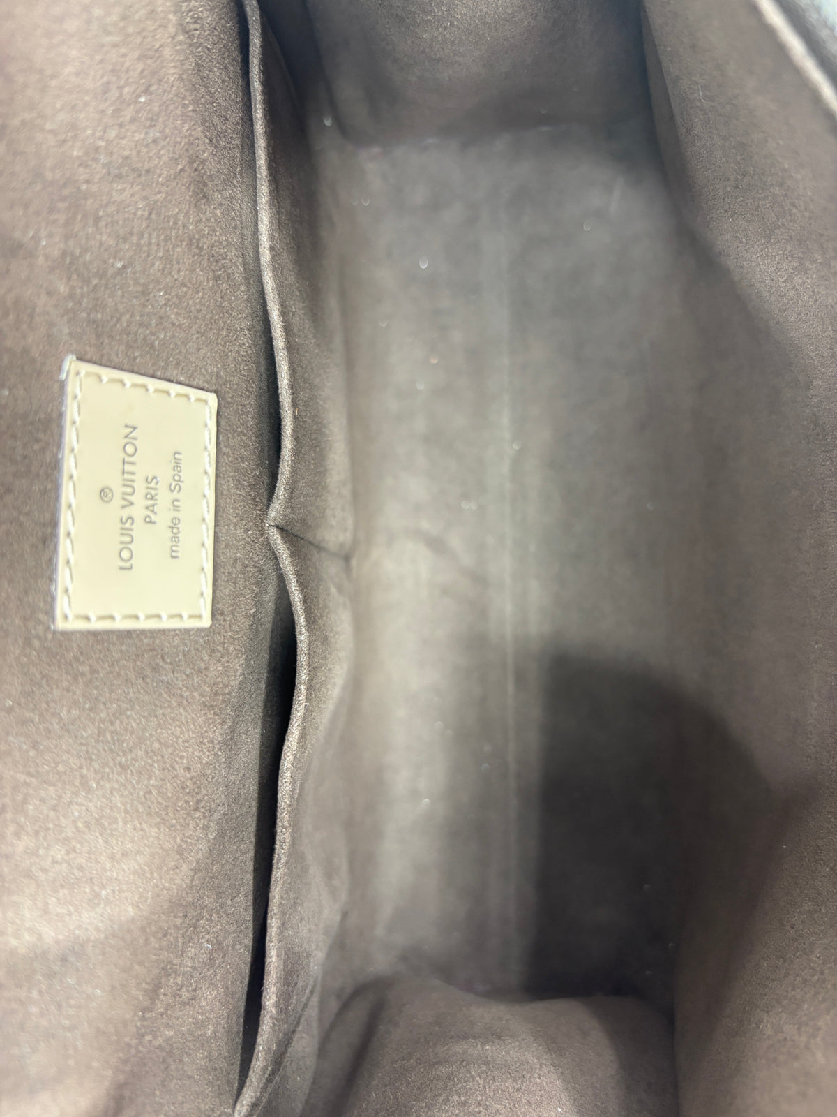 Interior of Posh Purse Co. Louis Vuitton Cluny MM handbag showing suede lining, slip pockets, and leather logo patch