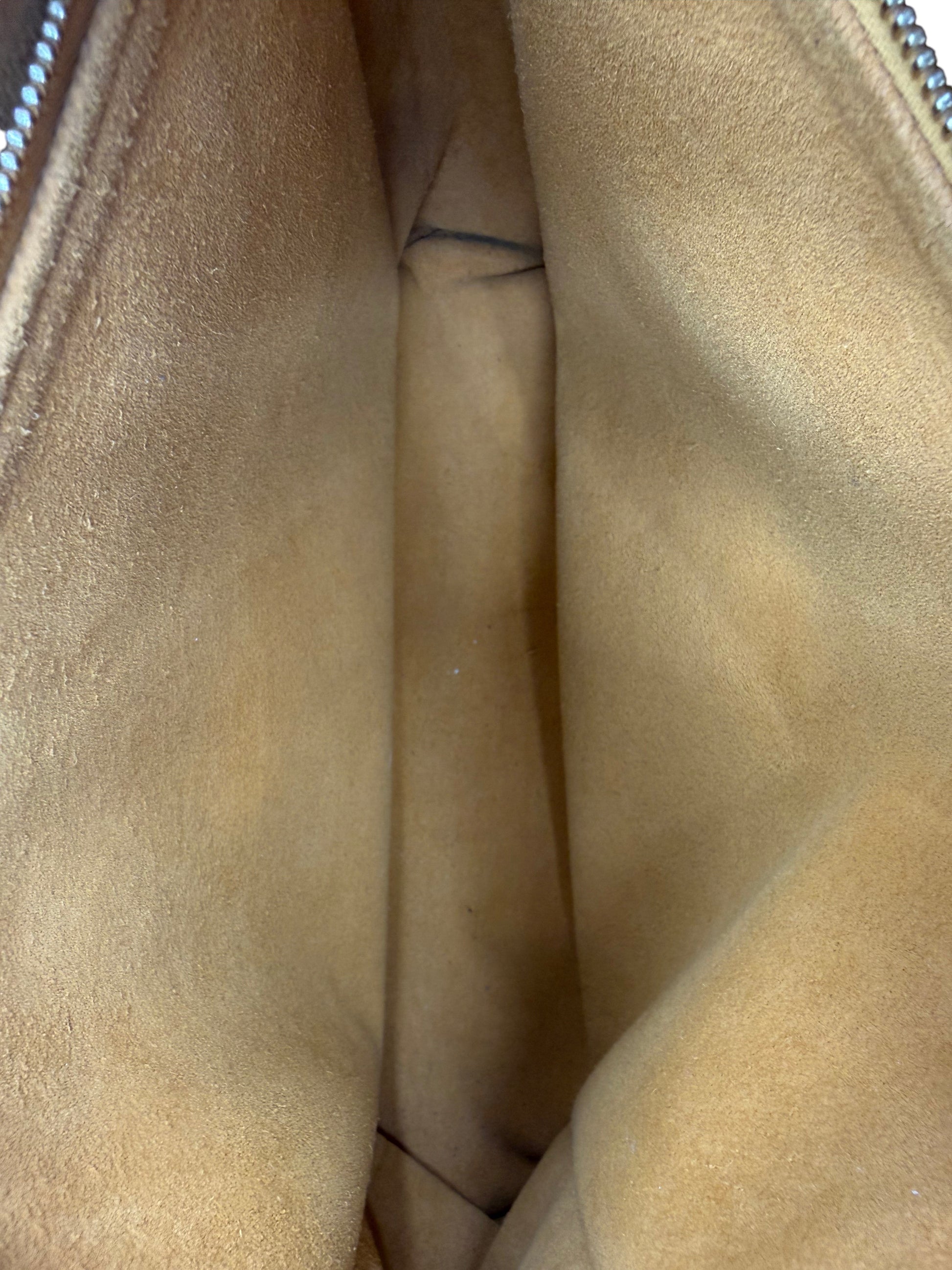 Interior view of Posh Purse Co preloved Louis Vuitton Coussin MM bag showing tan suede lining with minor marks