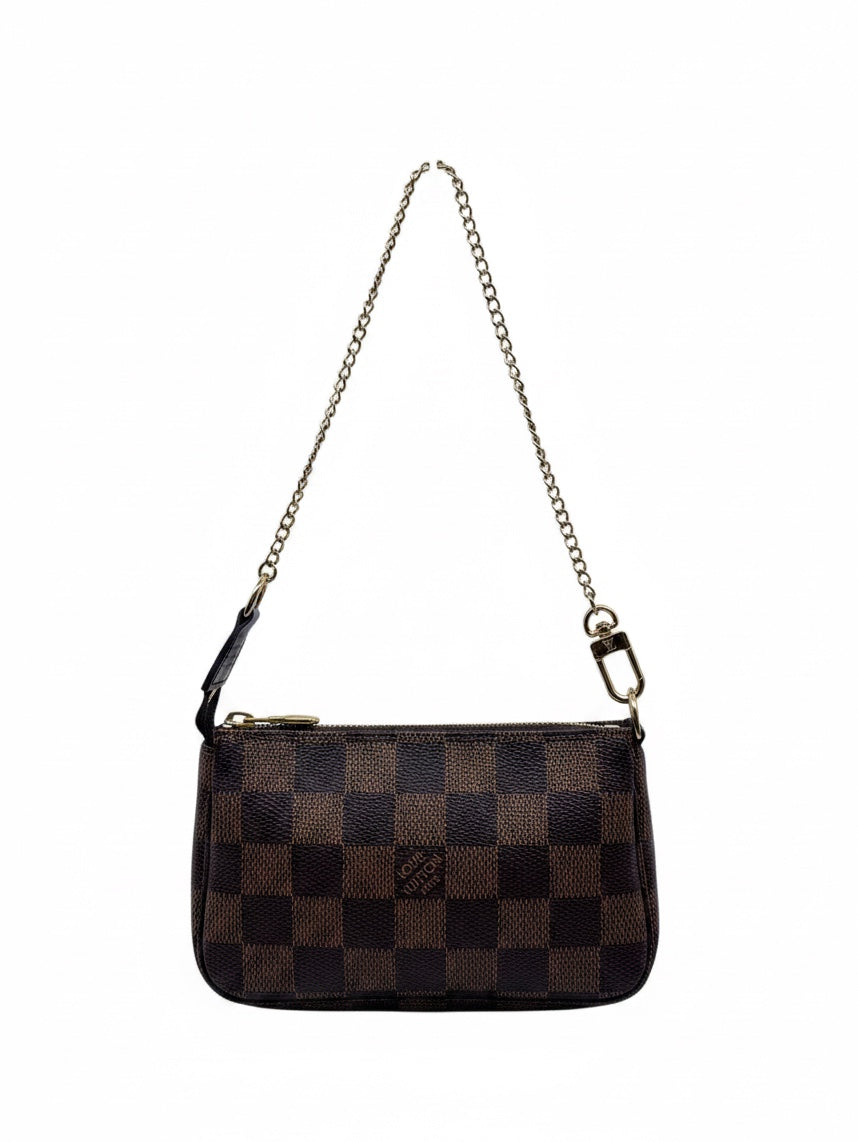 Posh Purse Co Louis Vuitton Damier Ebene Mini Pochette in brown checkered canvas with gold-tone chain strap