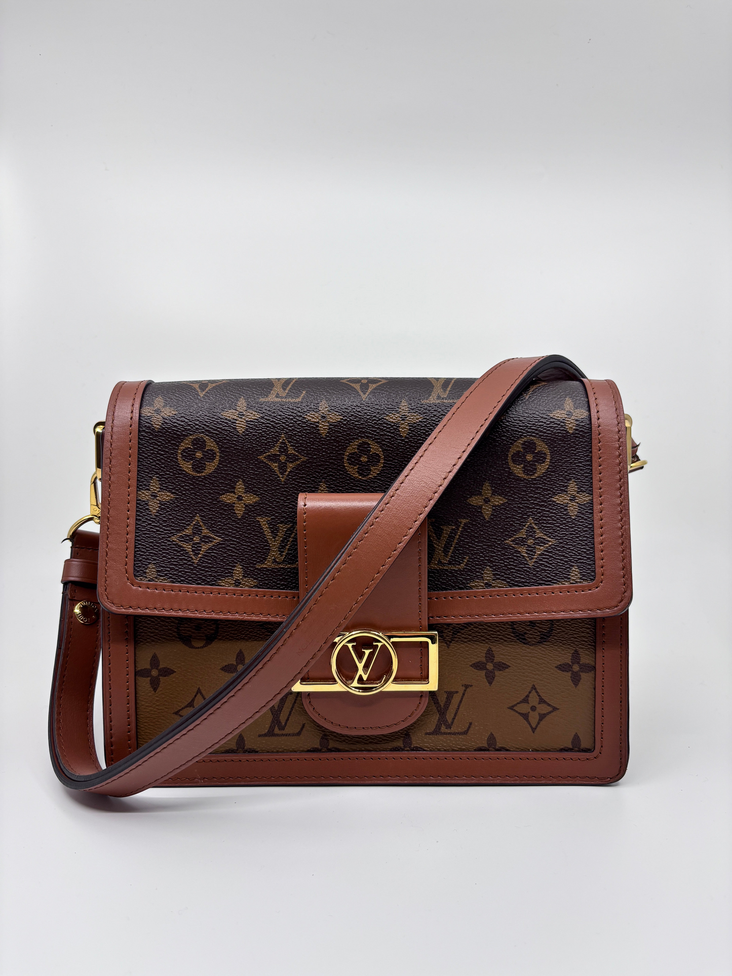 Posh Purse Co Louis Vuitton Dauphine MM in reverse monogram coated canvas with gold-tone LV hardware and leather trim.