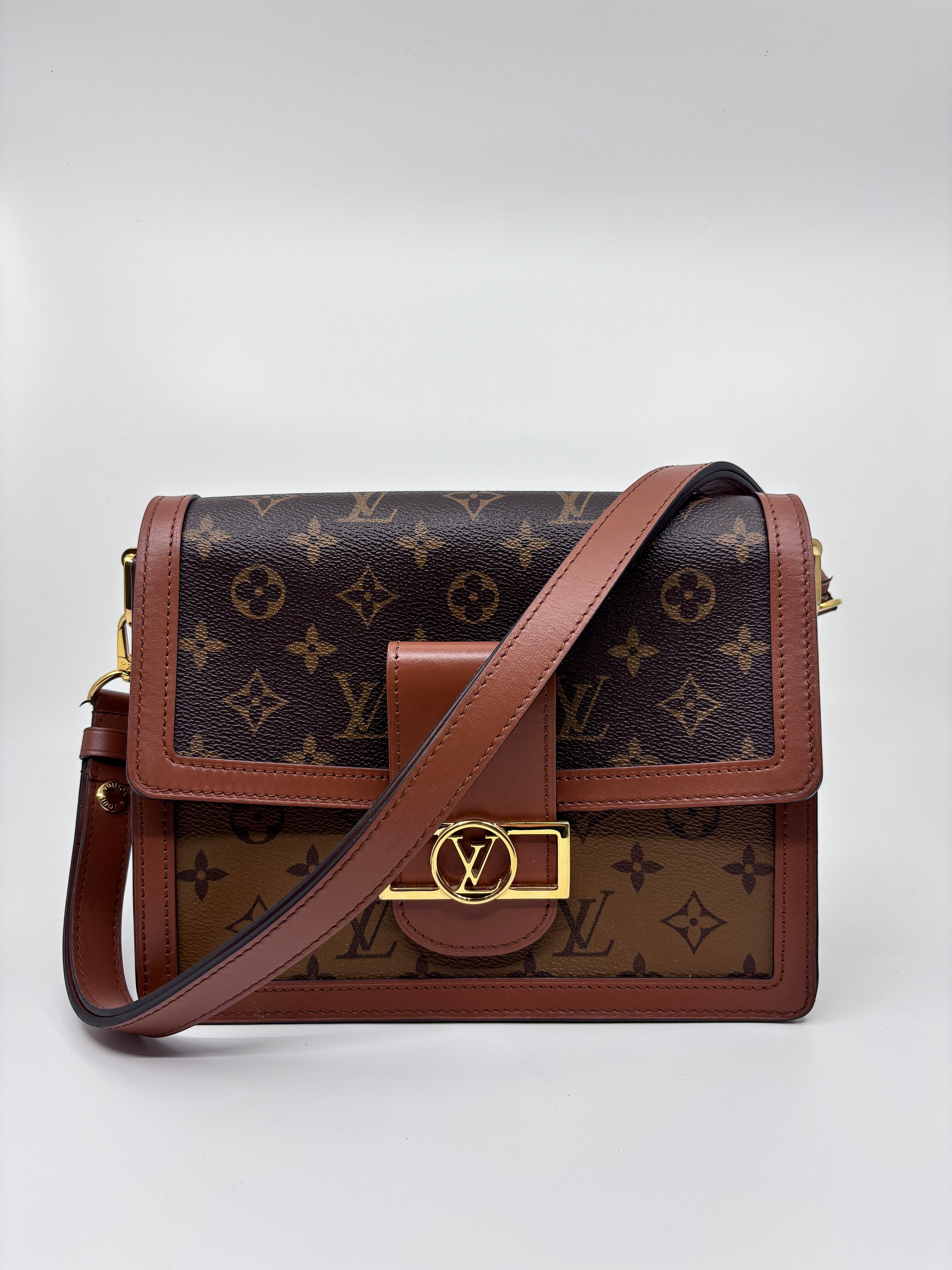 Posh Purse Co Louis Vuitton Dauphine MM in reverse monogram coated canvas with gold-tone LV hardware and leather trim.