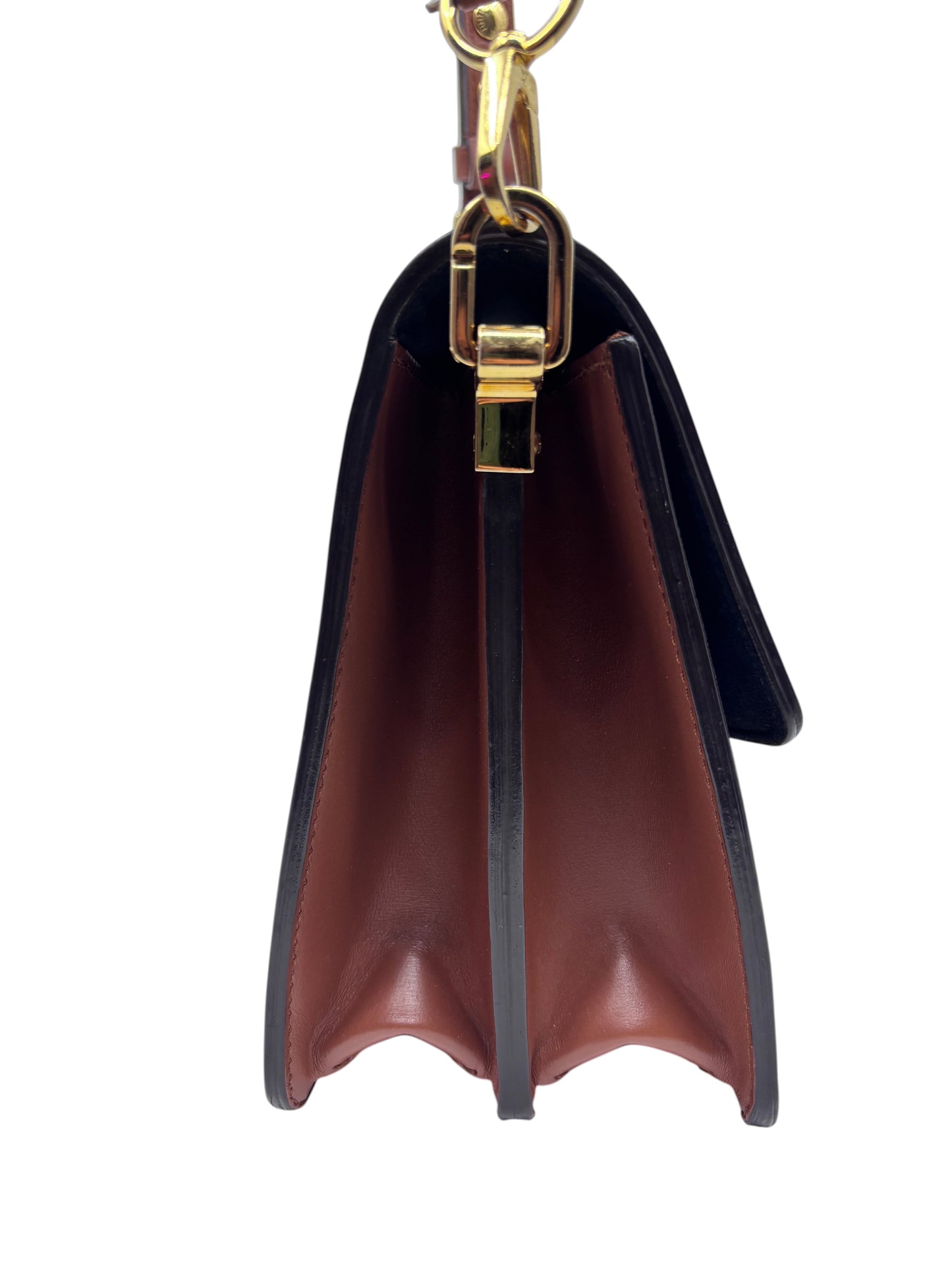 Side view of Posh Purse Co. Louis Vuitton Reverse Monogram Dauphine MM handbag with gold-tone hardware and leather trim.