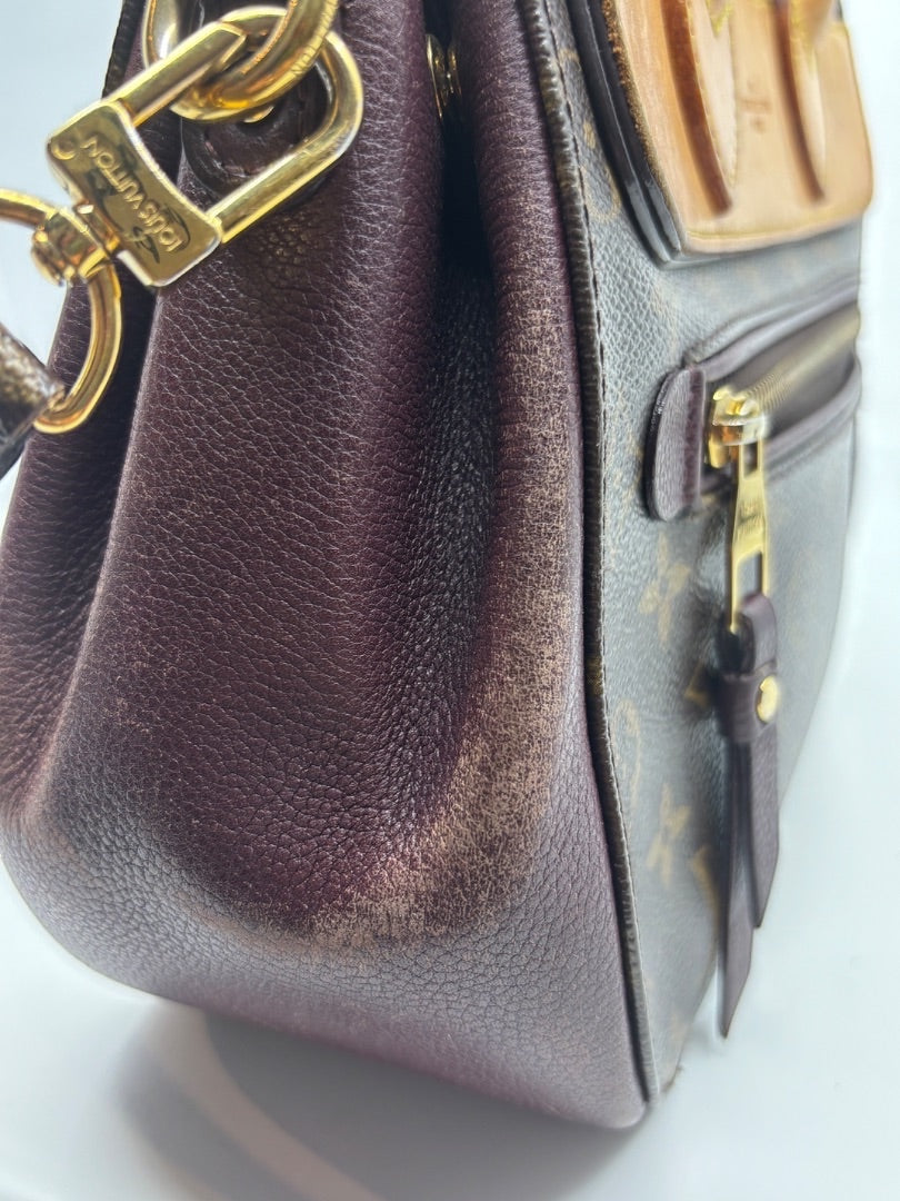 Posh Purse Co. preloved Louis Vuitton Eden MM bag featuring brown monogram canvas, dark leather trim, and gold hardware.