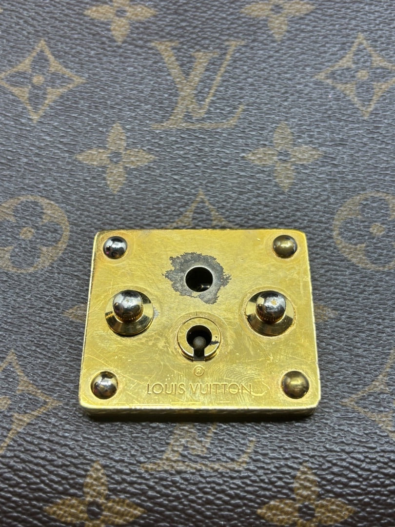 Close-up of gold-tone hardware on a Posh Purse Co. preloved Louis Vuitton Monogram Eden MM bag.