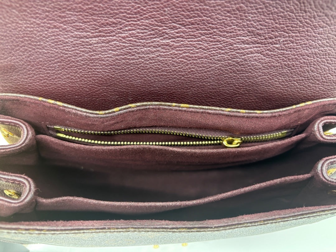 Interior of Posh Purse Co. Louis Vuitton Eden MM bag featuring deep burgundy suede lining and gold-tone zipper pocket.