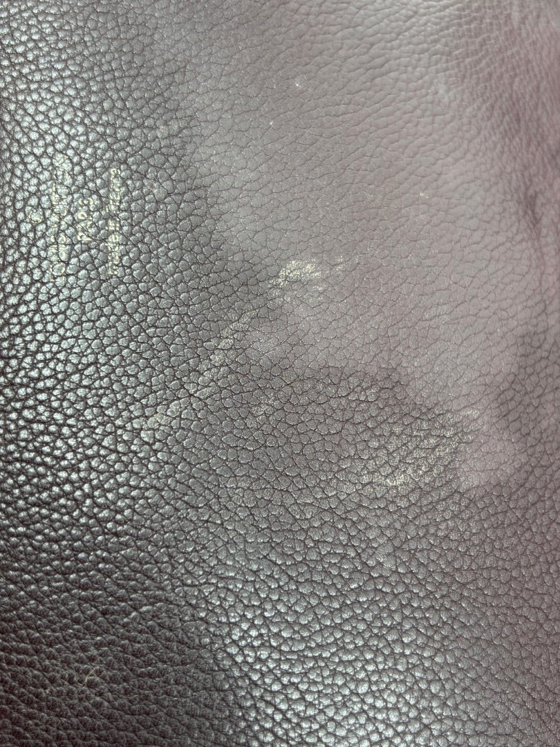 Close-up of brown leather texture on a preloved Louis Vuitton Eden MM bag from Posh Purse Co.
