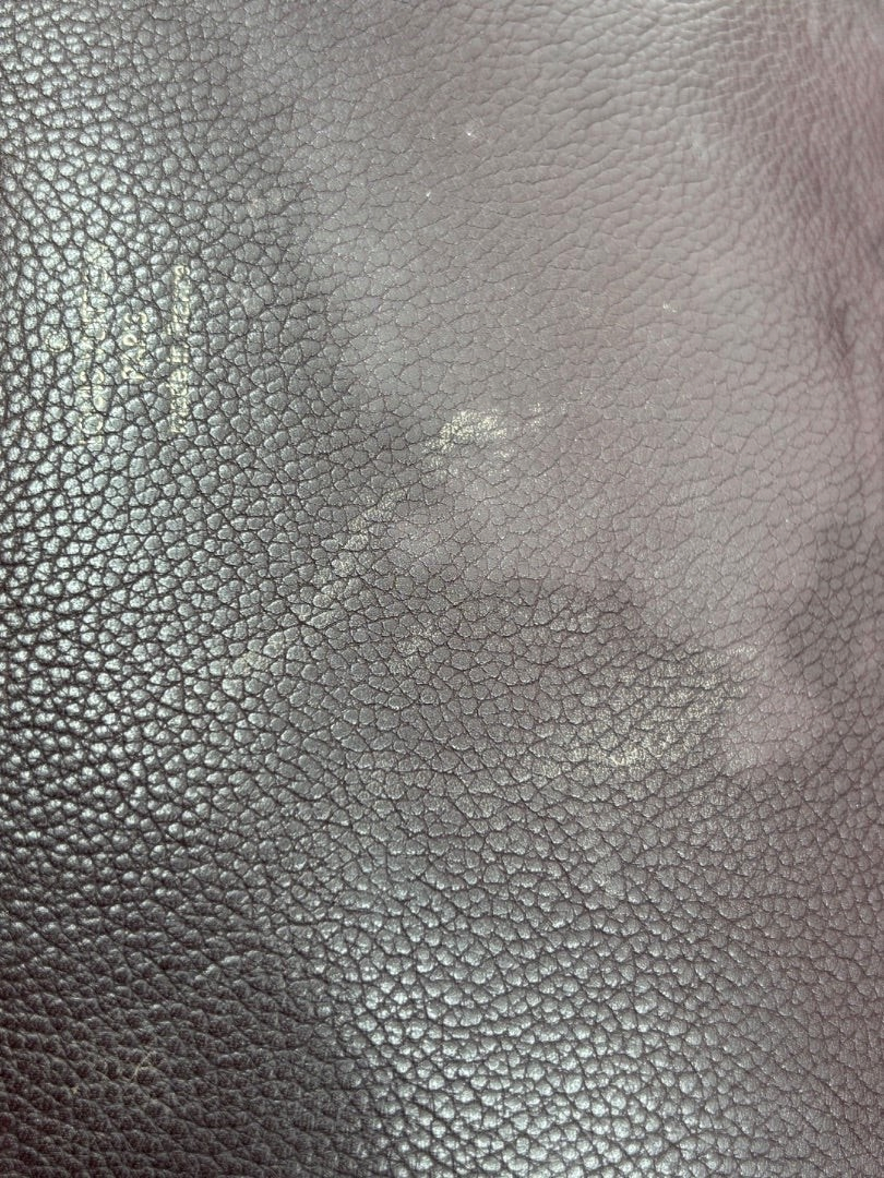 Close-up of brown leather texture on a preloved Louis Vuitton Eden MM bag from Posh Purse Co.