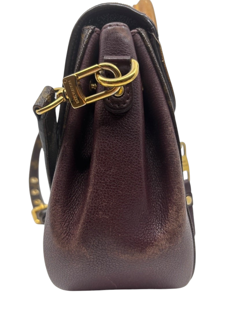 Side view of preloved Louis Vuitton Eden MM bag with brown leather trim and gold hardware from Posh Purse Co.