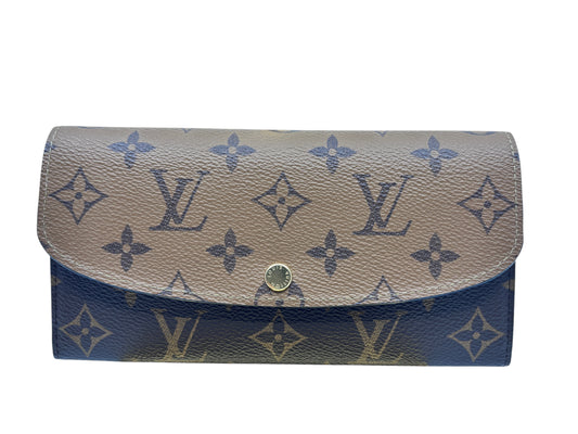 Posh Purse Co. Louis Vuitton Emilie wallet in Reverse Monogram coated canvas with gold-tone press-stud closure.