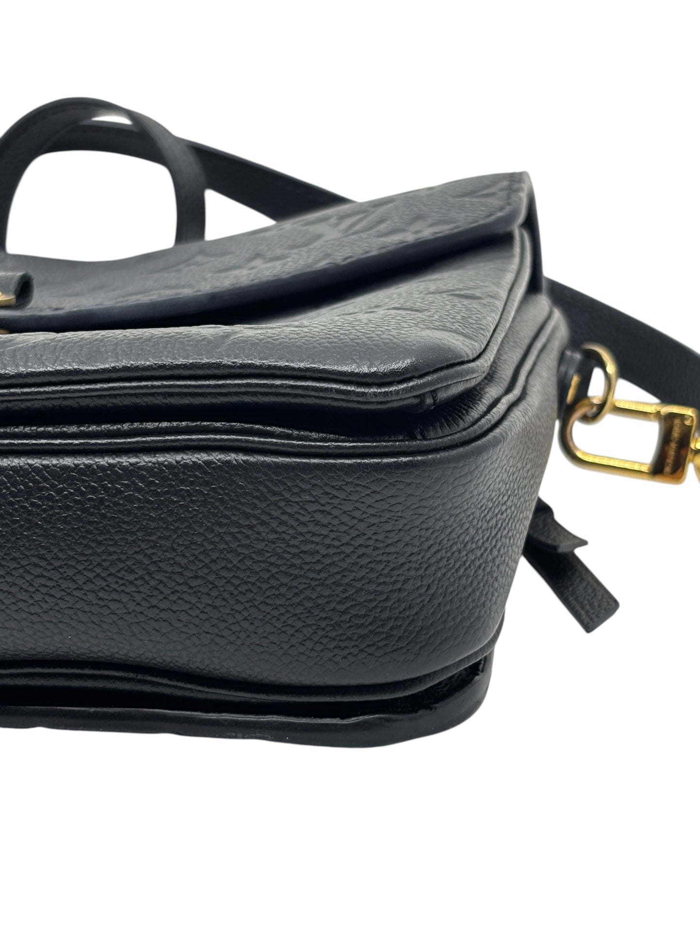 Posh Purse Co. black Louis Vuitton Empreinte Pochette Metis leather handbag side view with gold hardware