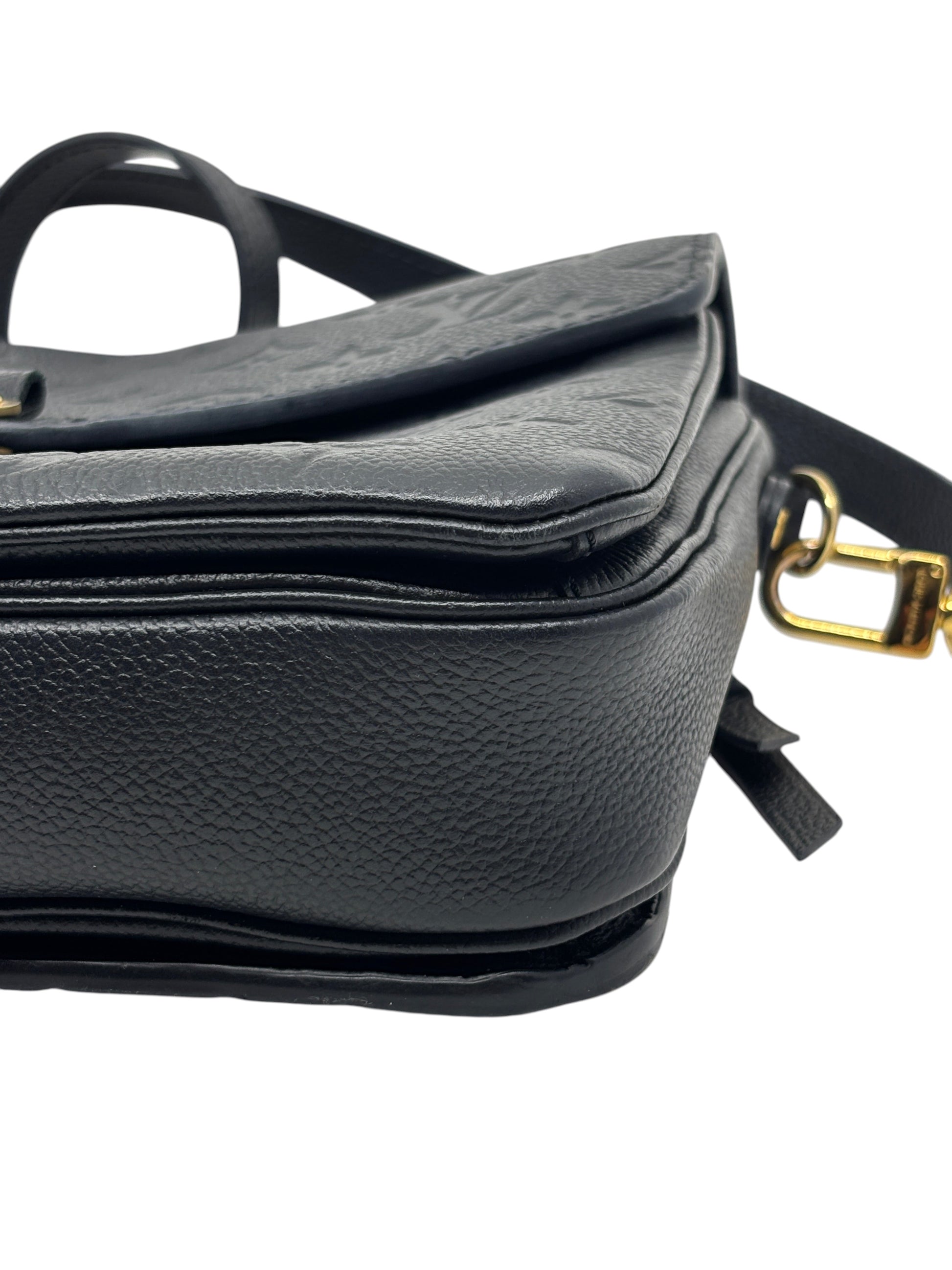 Posh Purse Co. black Louis Vuitton Empreinte Pochette Metis leather handbag side view with gold hardware