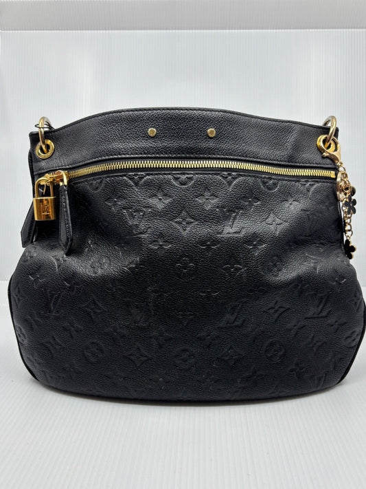 Black Louis Vuitton Monogram Empreinte Spontini handbag with gold hardware, available at Posh Purse Co.