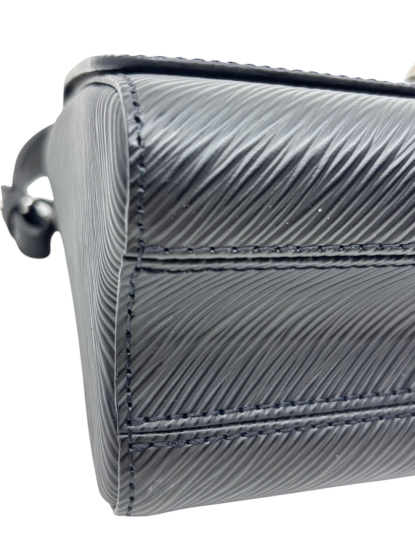 Close-up of black textured Epi leather on a Posh Purse Co Louis Vuitton Twist bag showing detailed stitching.
