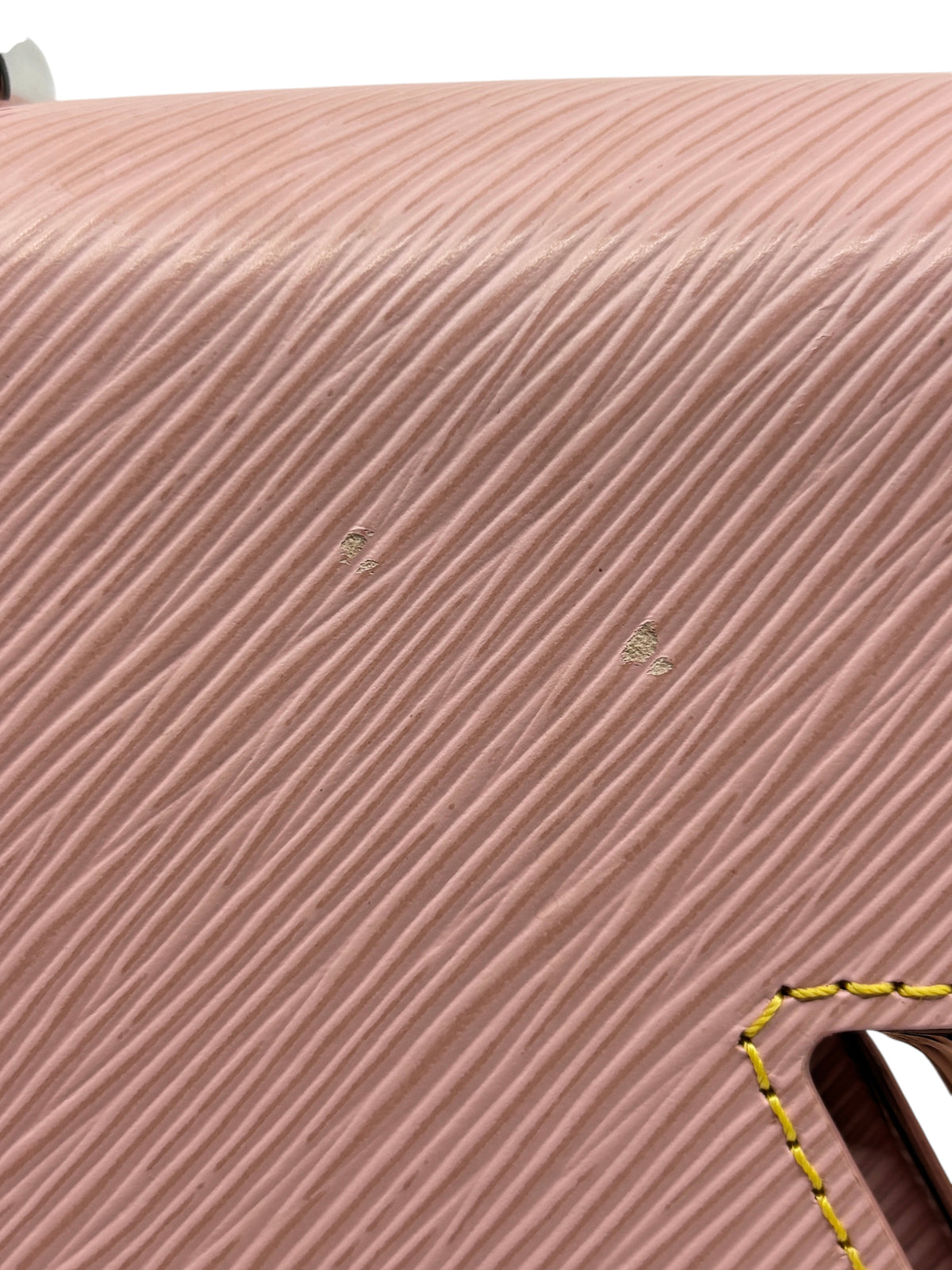 Posh Purse Co Louis Vuitton Epi leather bag in pink showing minor surface wear marks on the textured exterior.