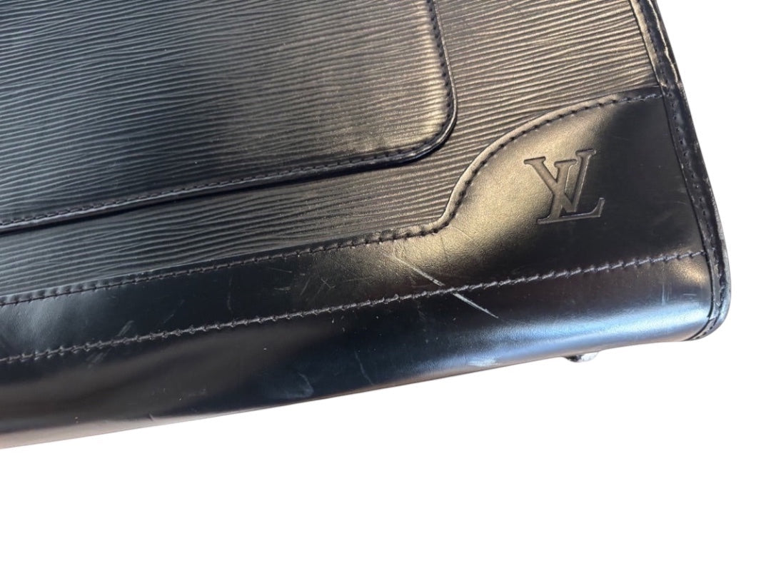 Posh Purse Co. black Louis Vuitton Epi leather Madeleine handbag with LV logo detail and textured finish.