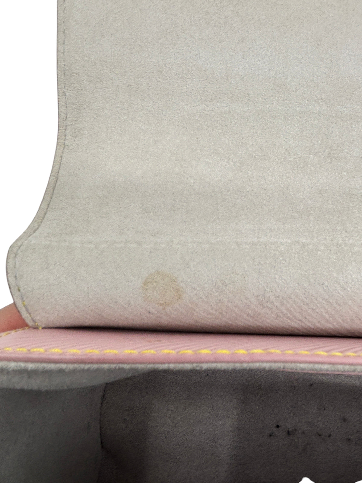 Posh Purse Co Louis Vuitton Epi Twist MM interior lining showing a small circular pen mark on the light suede fabric