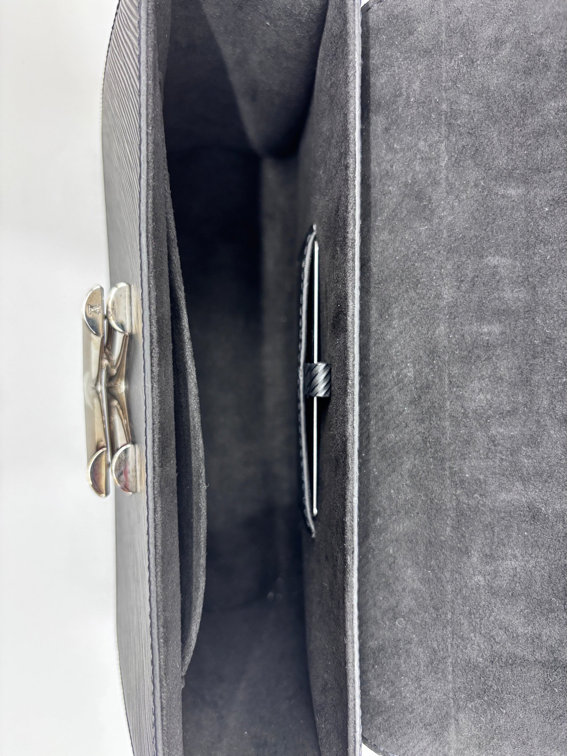 Posh Purse Co black Louis Vuitton Epi leather Twist bag interior view showing clean suede lining and hardware