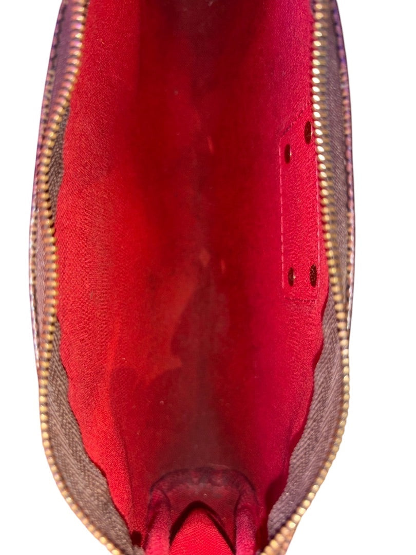 Posh Purse Co. Louis Vuitton Eva Clutch in monogram coated canvas with red interior and gold-tone zipper.