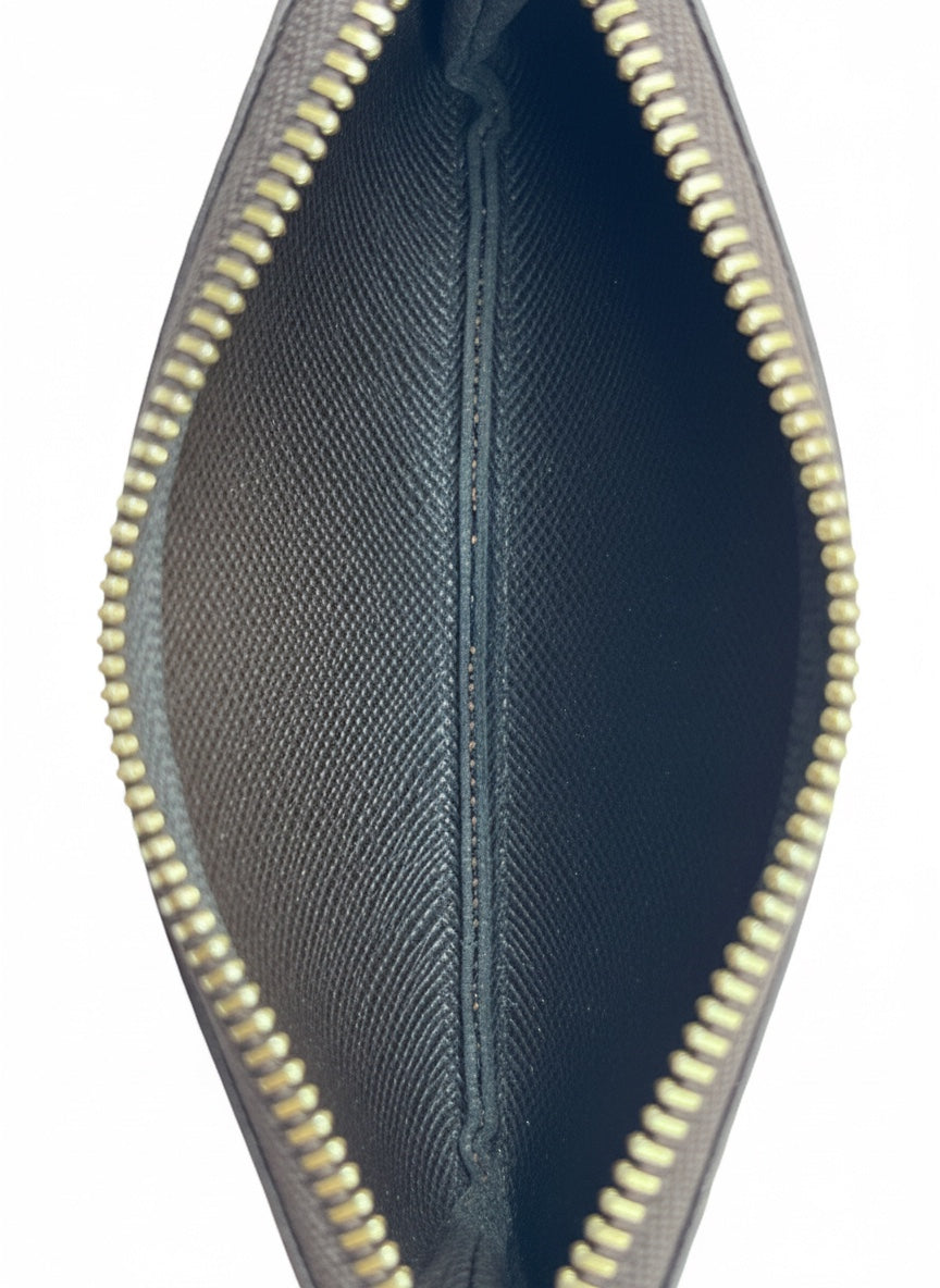 Interior view of Posh Purse Co. Louis Vuitton Damier Ebene key pouch featuring grained dark brown leather lining.