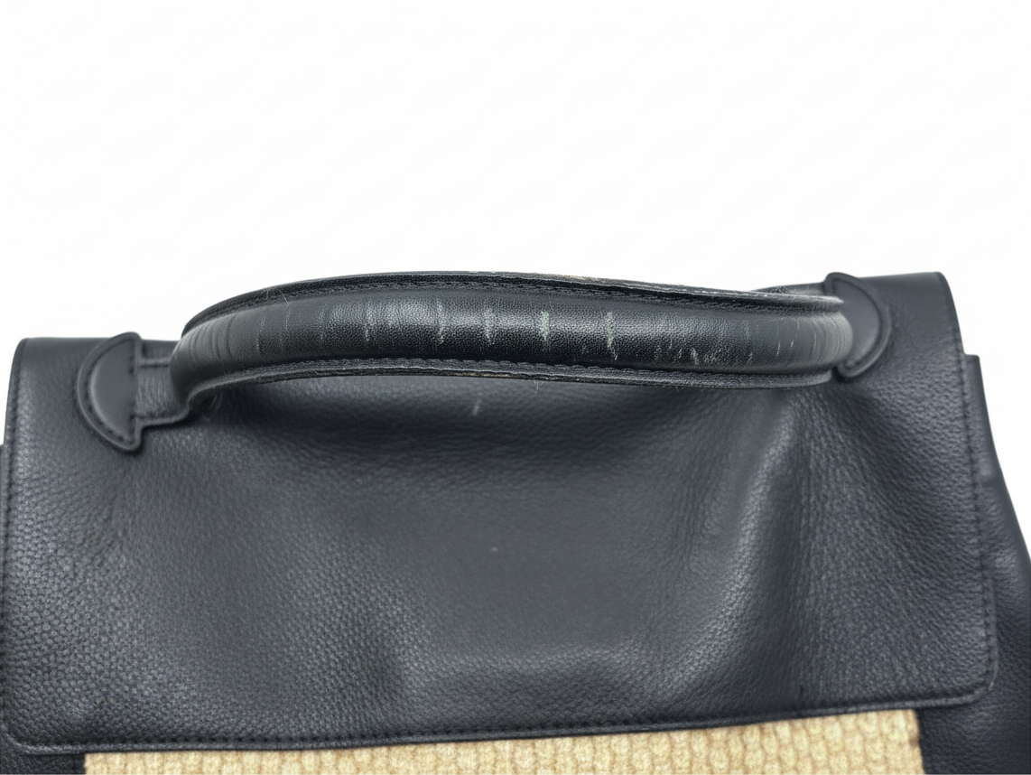 Posh Purse Co Louis Vuitton LockMe MM handbag top handle showing leather wear and peeling on black grained leather