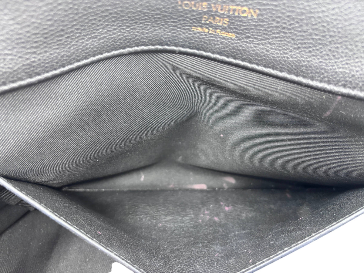 Interior of Posh Purse Co preloved Louis Vuitton LockMe MM handbag showing black fabric lining with makeup stains