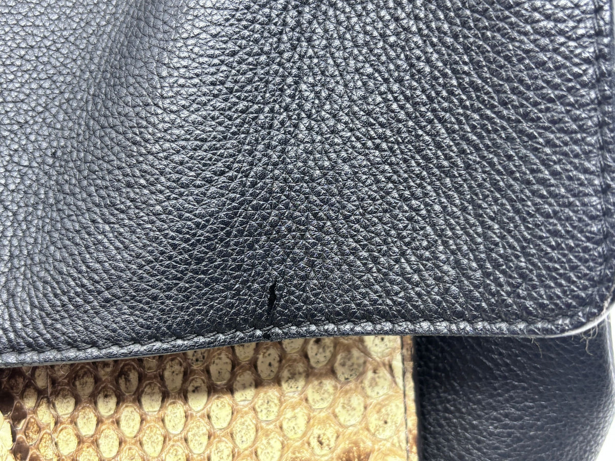Posh Purse Co Louis Vuitton LockMe MM handbag detail showing black pebbled leather and textured python skin accents