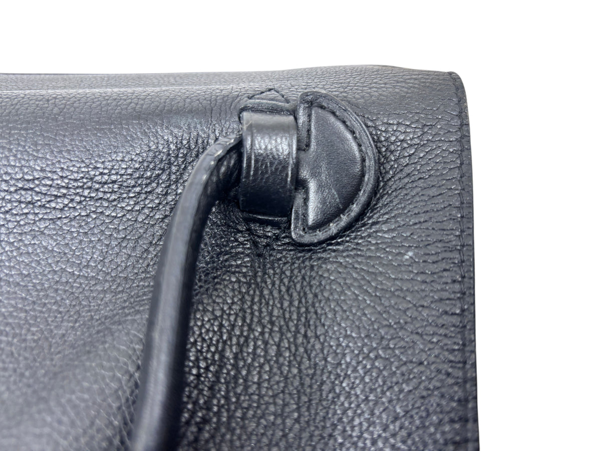 Close-up of black leather handle attachment on a Posh Purse Co preloved Louis Vuitton LockMe MM handbag