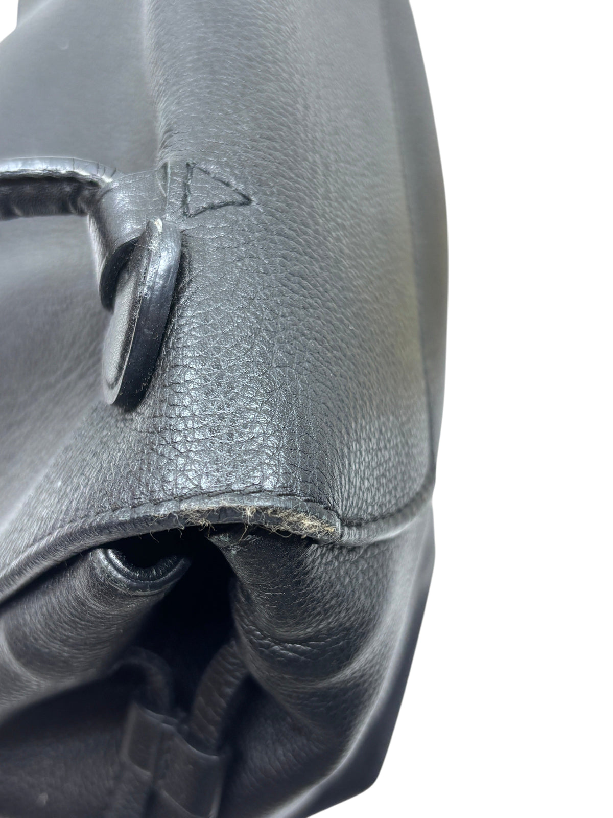 Posh Purse Co preloved Louis Vuitton LockMe MM handbag showing close-up of black leather wear and handle attachment