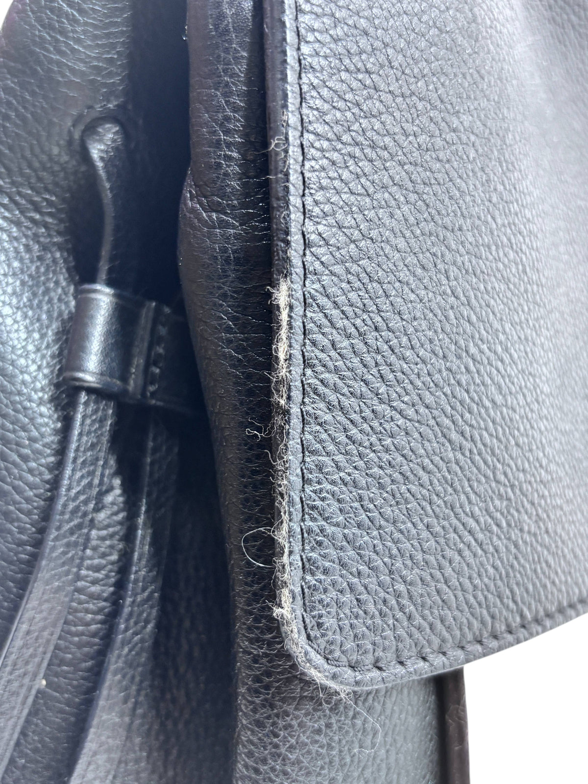 Posh Purse Co preloved Louis Vuitton LockMe MM black leather handbag showing edge wear and material texture
