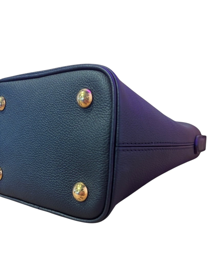 Posh Purse Co. Louis Vuitton Lowkey Carryall base with gold-tone protective feet and black grained leather.