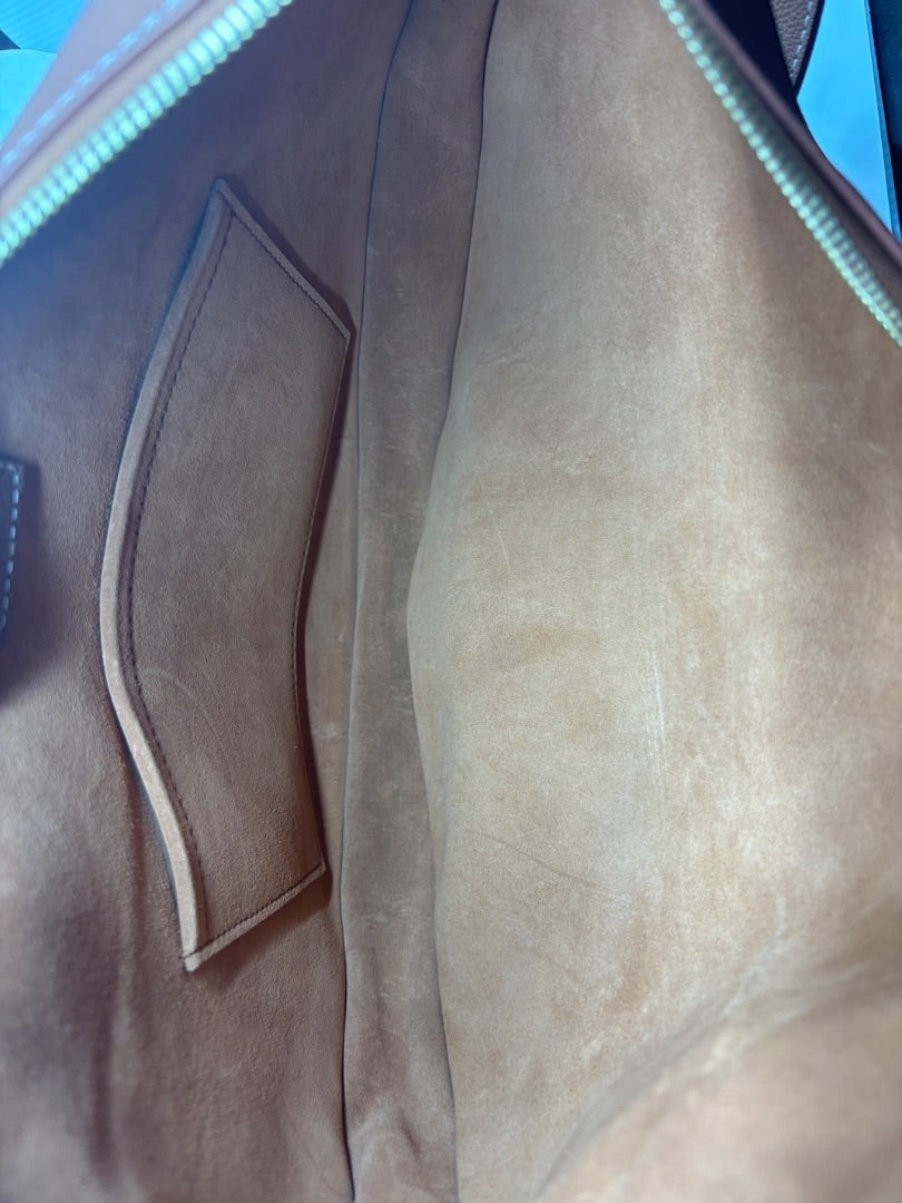 Posh Purse Co. Louis Vuitton Lowkey Cookie bag interior with tan suede lining and a small pocket.
