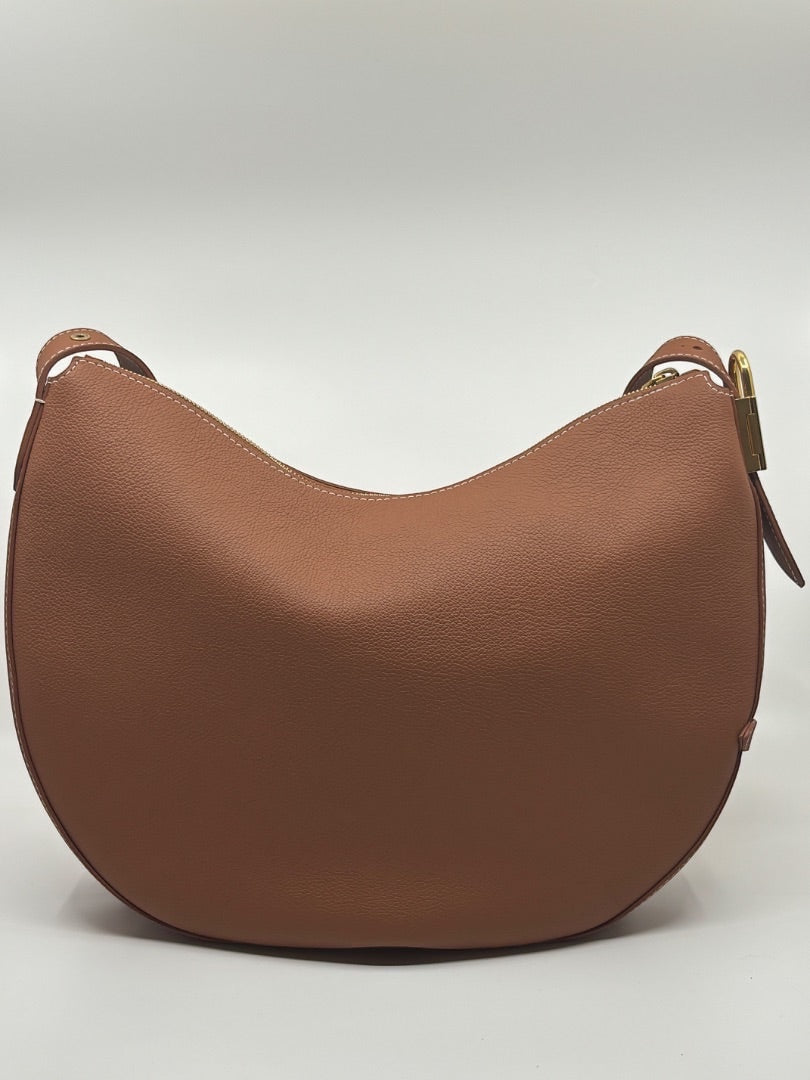 Posh Purse Co. Louis Vuitton Lowkey Cookie bag in tan pebbled leather with gold hardware. Crescent shape, zip closure.