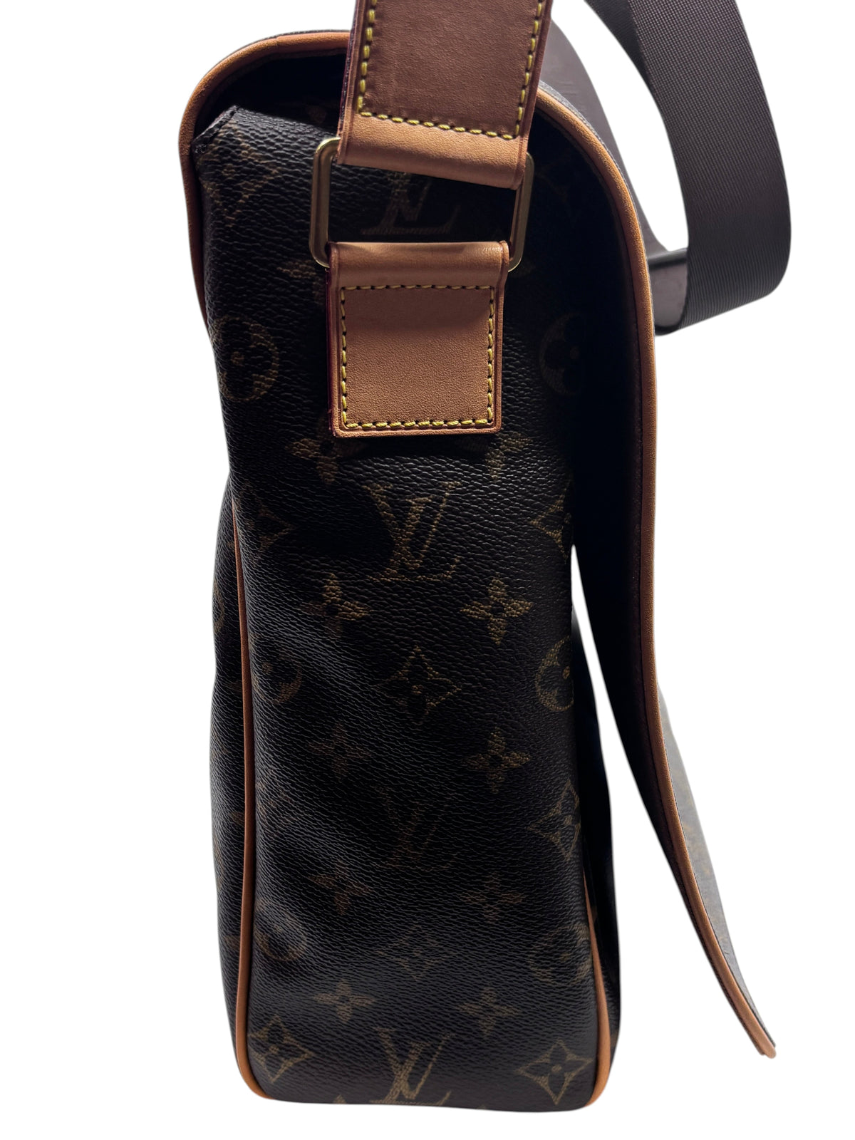 Side view of a Posh Purse Co preloved Louis Vuitton Monogram Abbesses messenger bag with natural leather trim.
