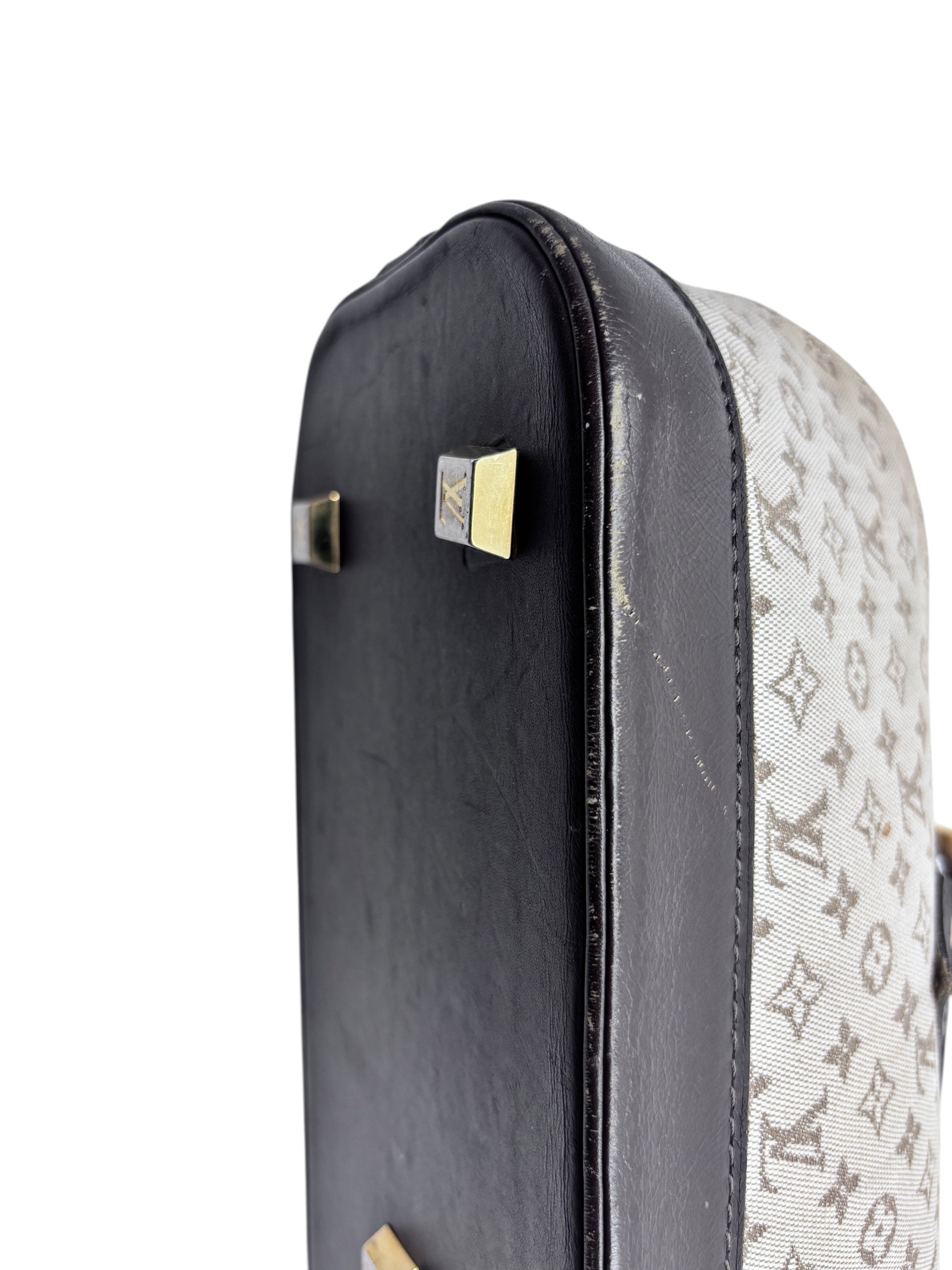 Posh Purse Co preloved Louis Vuitton Long Mini Lin bag showing the dark leather base with gold protective feet