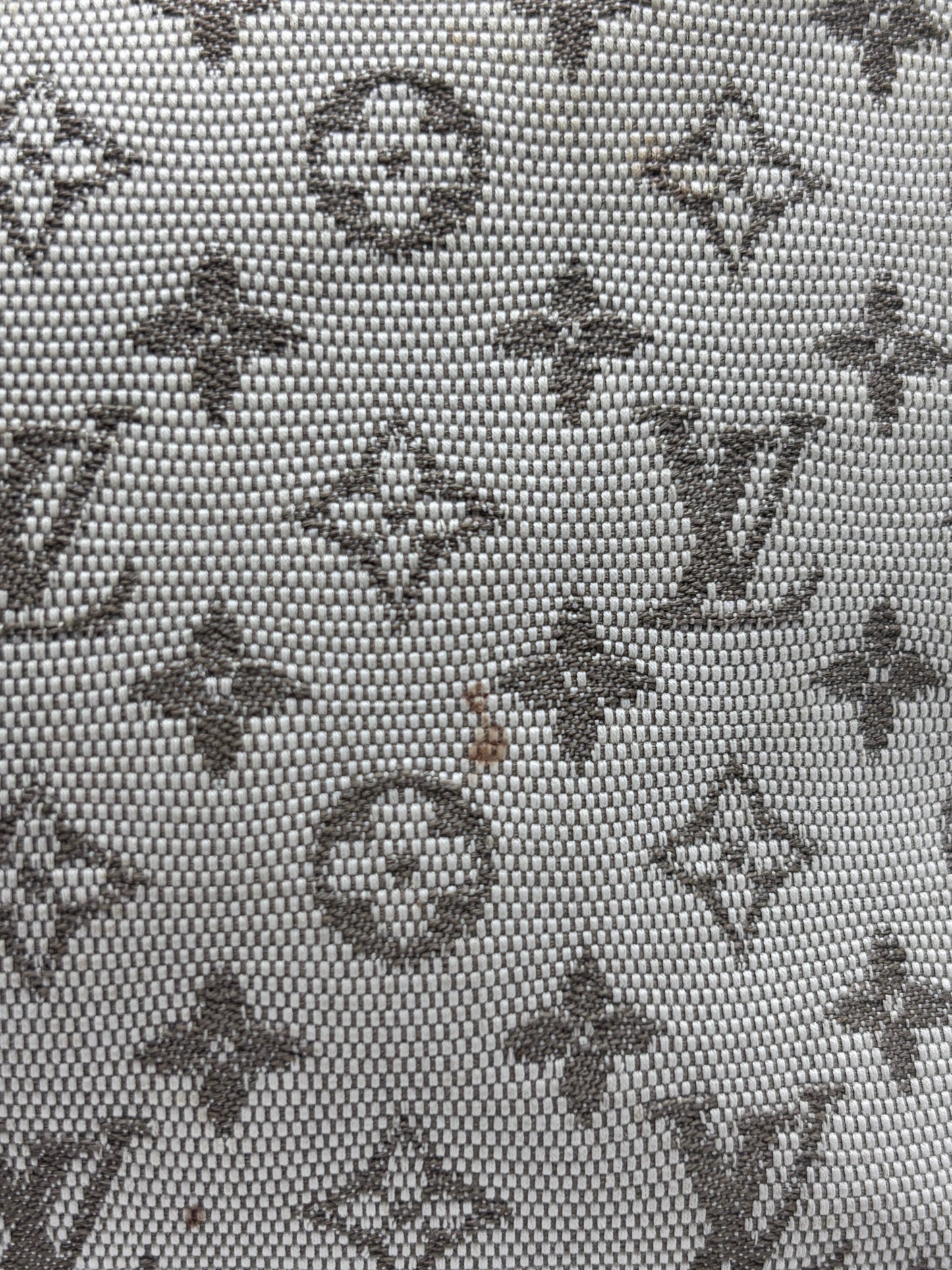 Close-up of Posh Purse Co preloved Louis Vuitton Mini Lin monogram canvas fabric in beige and brown