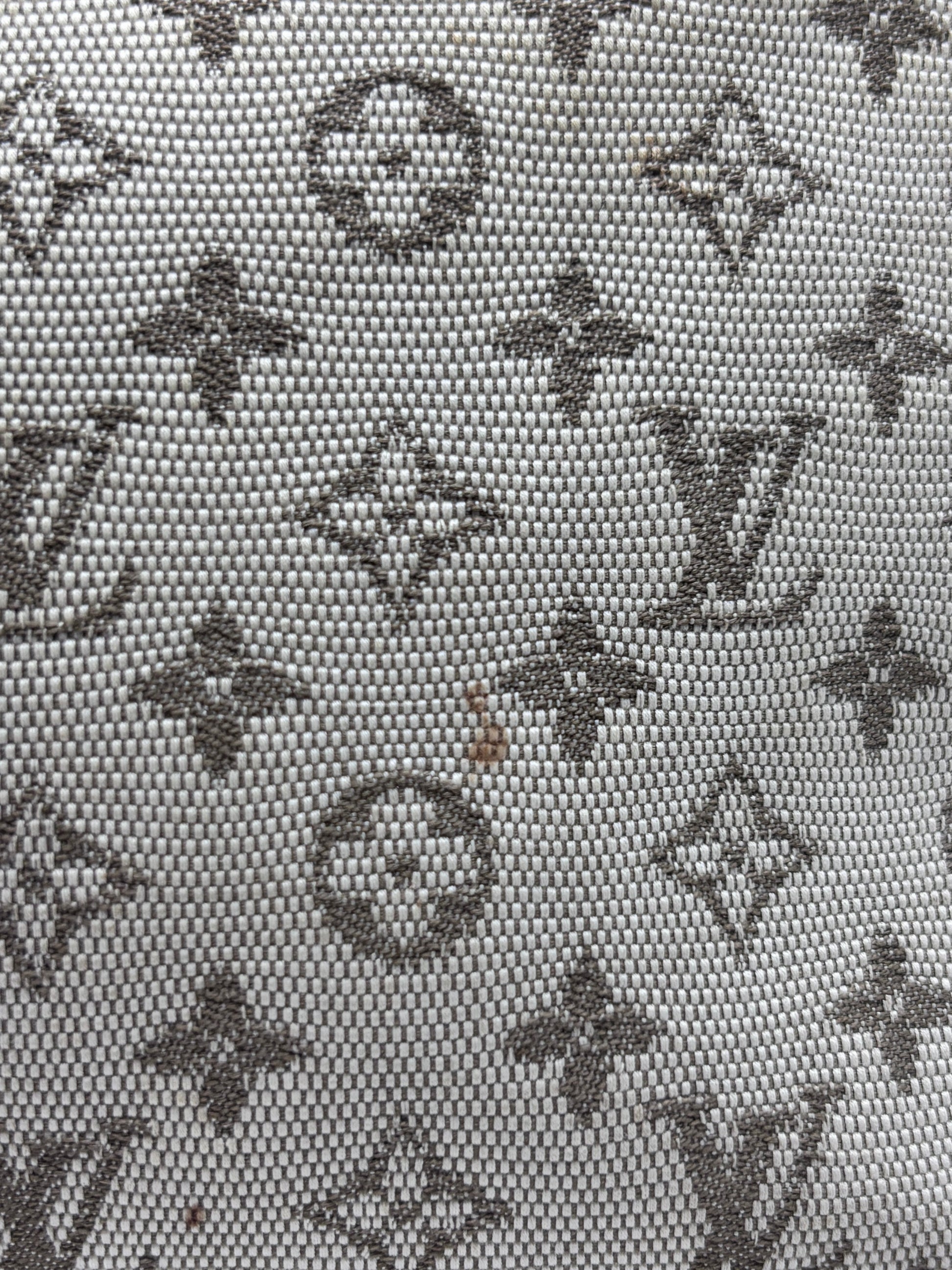 Close-up of Posh Purse Co preloved Louis Vuitton Mini Lin monogram canvas fabric in beige and brown