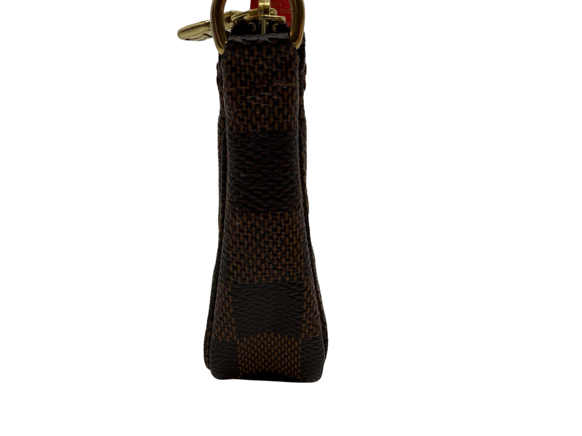 Side view of Posh Purse Co Louis Vuitton 2016 Christmas Animation Mini Pochette in brown Damier Ebene canvas