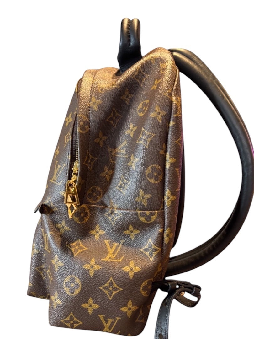Posh Purse Co Louis Vuitton Palm Springs backpack in brown monogram coated canvas with gold hardware and black leather trim.