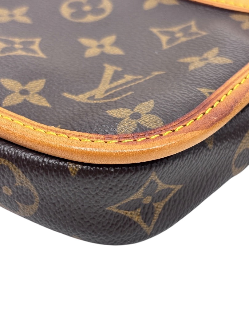 Close-up of Posh Purse Co Louis Vuitton Bosphore belt bag in iconic brown monogram coated canvas with vachetta trim.