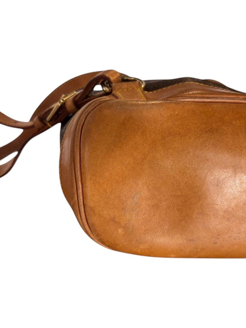 Posh Purse Co. Louis Vuitton Monogram Bucket Montsouris backpack with tan vachetta leather trim and straps.